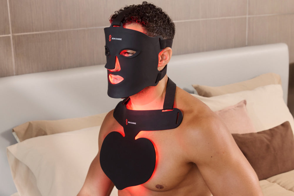 Man Looking to Side, Wearing Red Light Face Mask and a Neck and Chest Mask