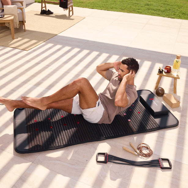 Man Doing Workout On Infrared PEMF Mat Max